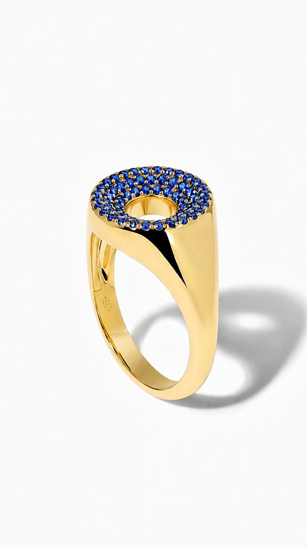 Oculus Ring — a pavé disc of natural blue sapphires around an open circle, champagne gold-plated sterling silver 925.